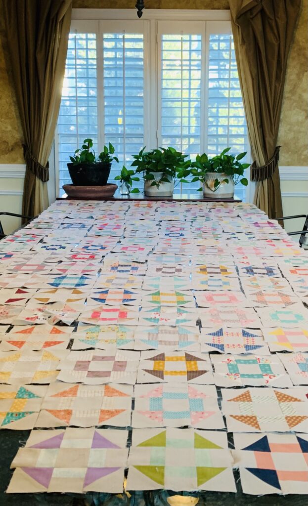 Handmade Quilts, Pouches & Fabric Gifts | Hand Stitched Pieces large handmade quilt layout on table